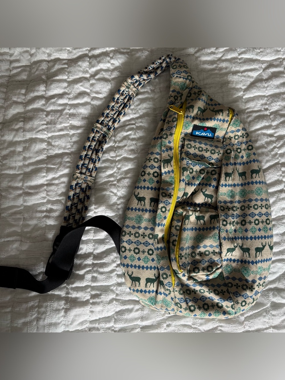 Kavu Beige Sling Bag with Yellow Zipper and Teal Print
